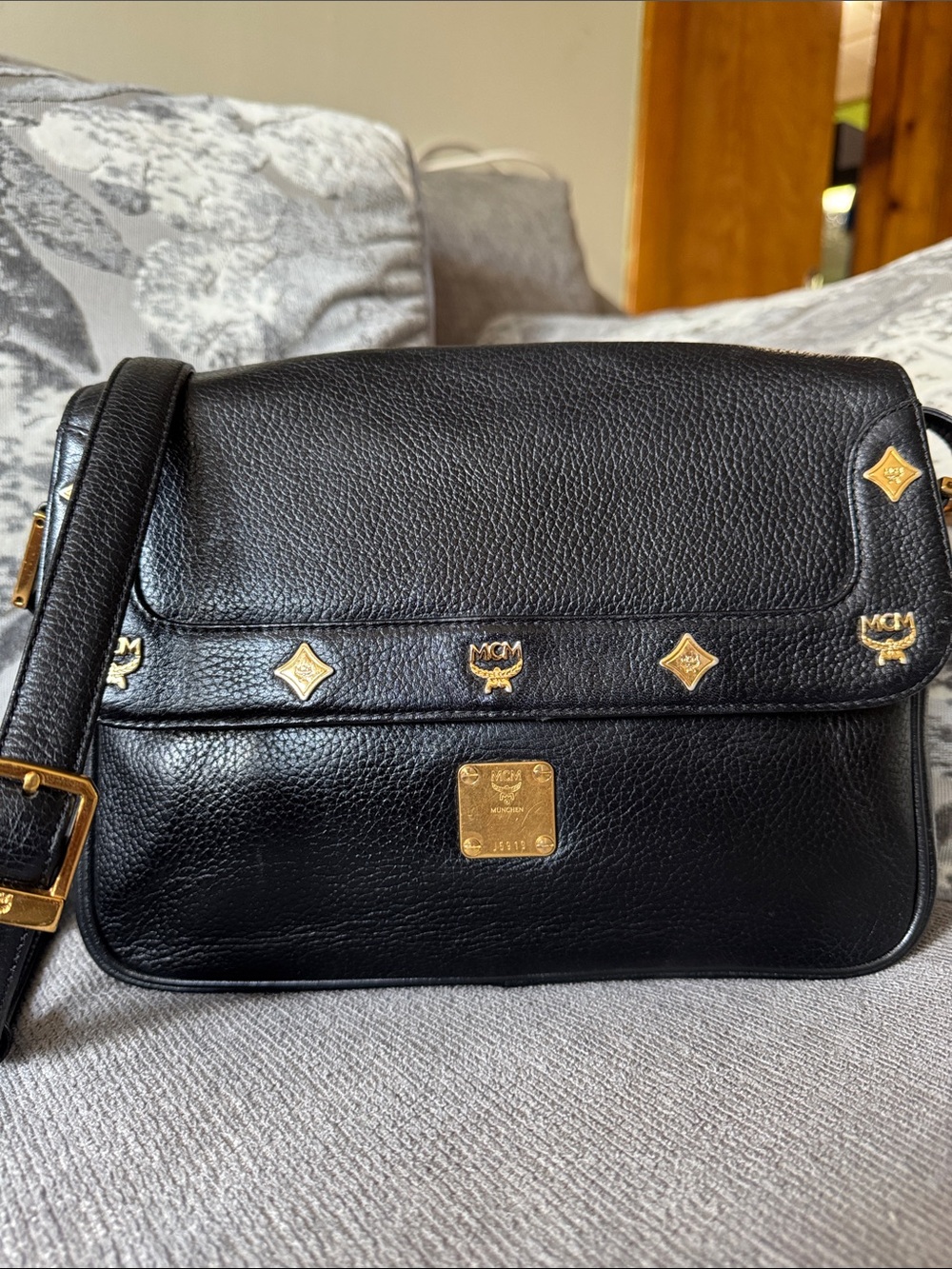 MCM Black Leather Messenger with Gold Accents